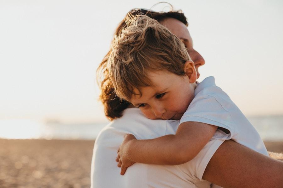 Child hugging a woman in warm daylight